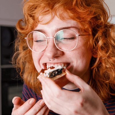someone enjoying award-winning honestly tasty plant-based cheese