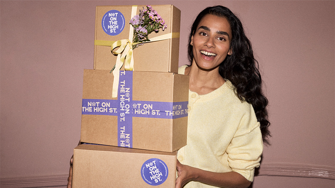 hand holding colourful cups