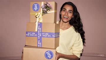 hand holding colourful cups