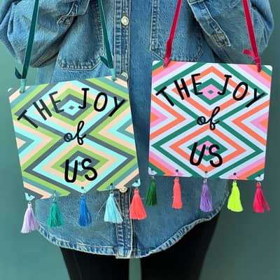 The Joy Of Us Tin Sign