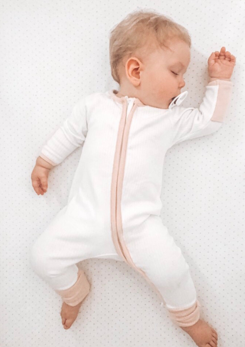 white and pink zip up babygrow