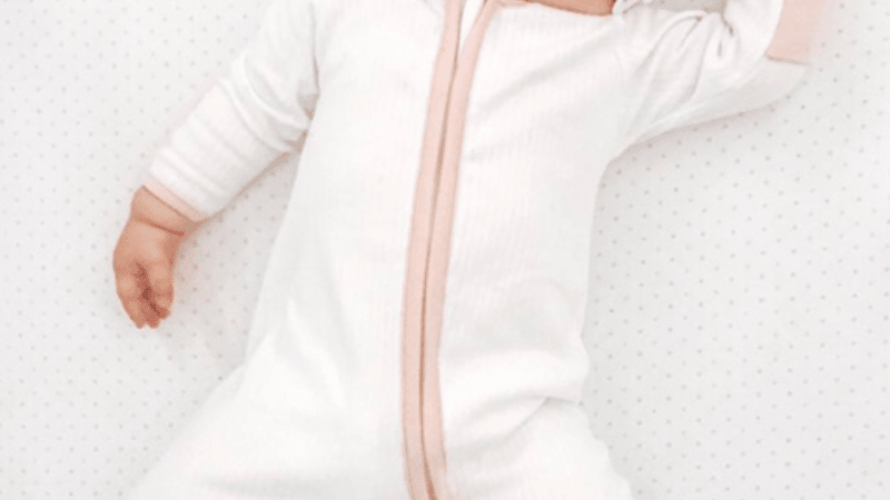white and pink zip up babygrow