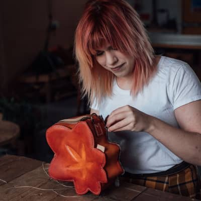 Pipa sewing a Maple Leaf pochette