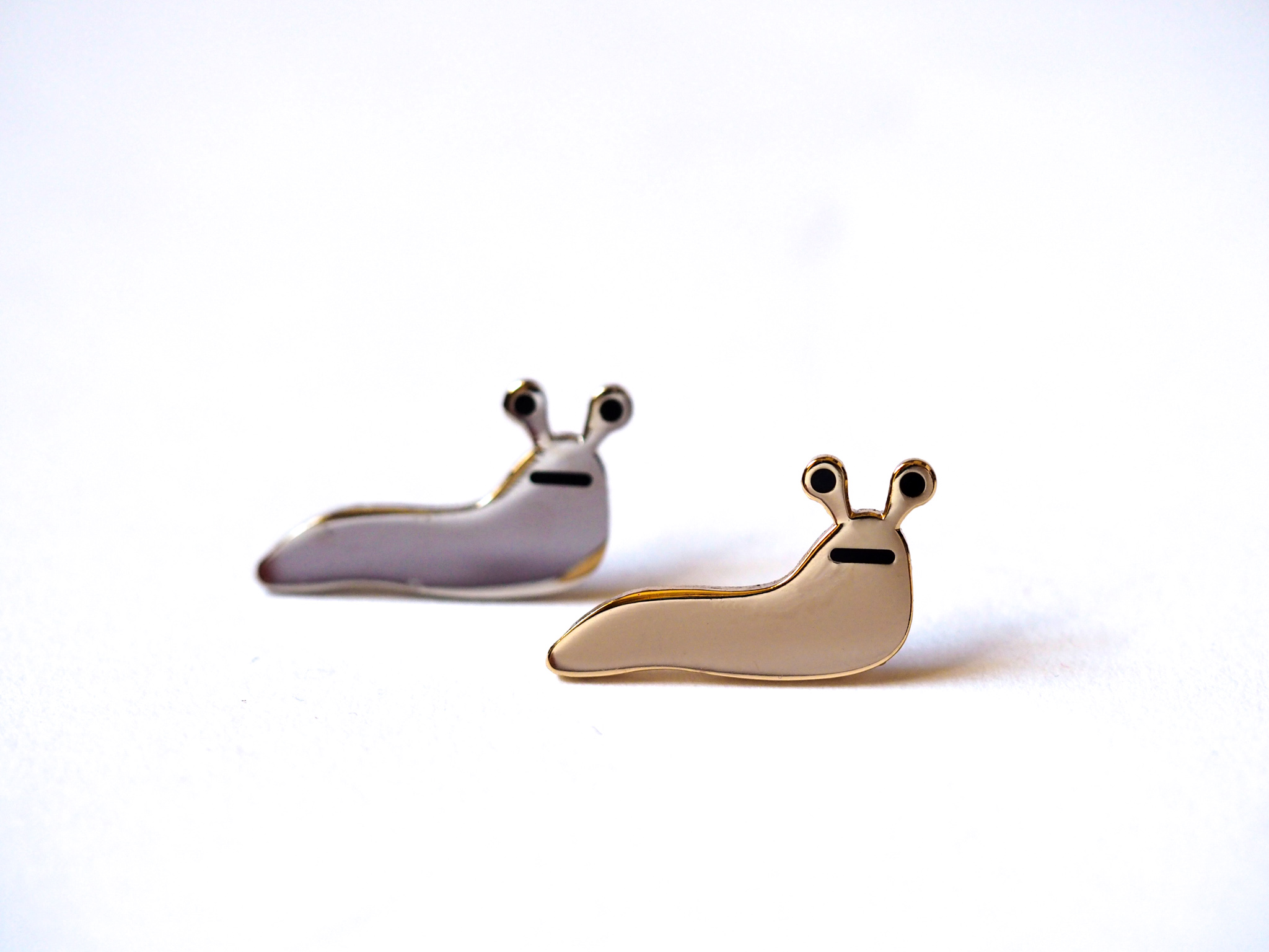 Slug Enamel Pin is Silver or Gold