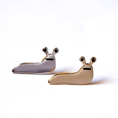 Slug Enamel Pin is Silver or Gold