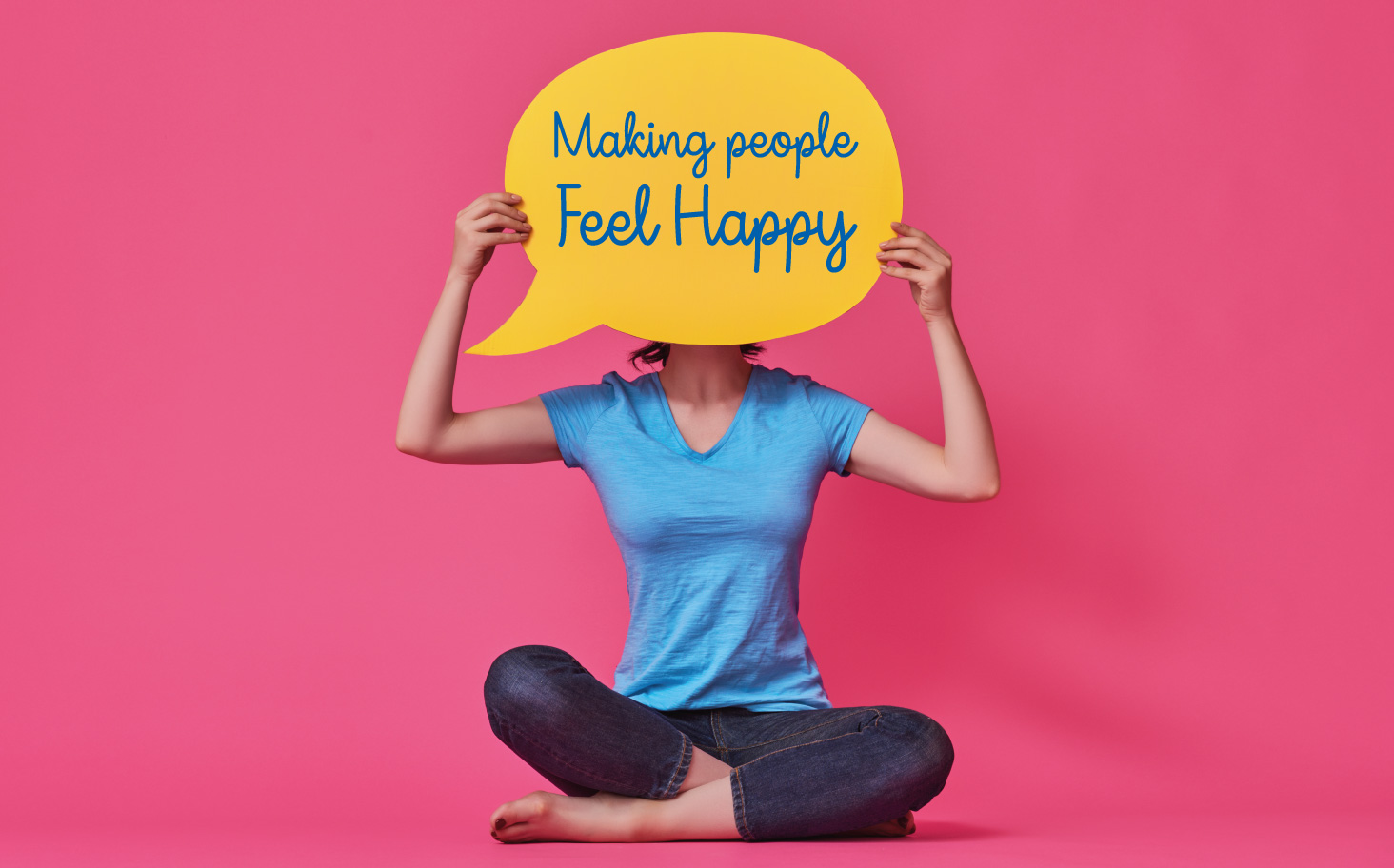 woman holding happy speech bubble