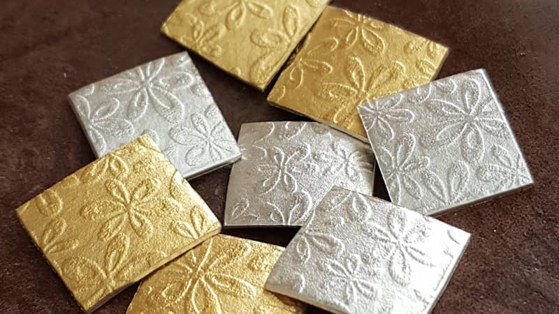 Watercolour gold and silver earrings being made