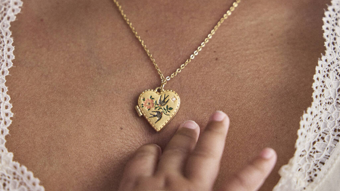 Heart necklace with floral enamel detail