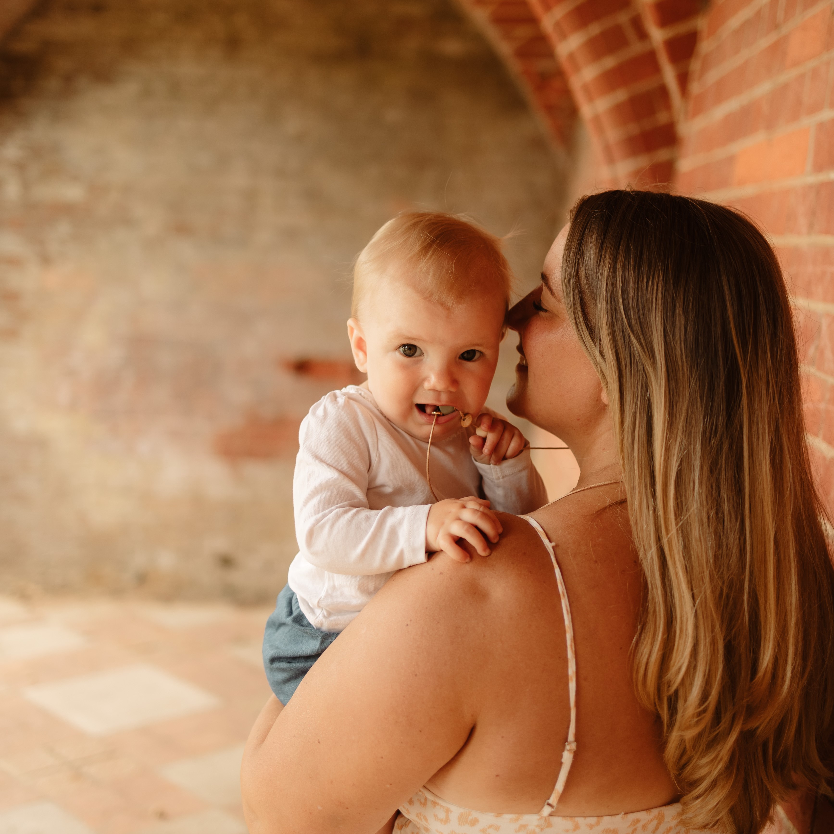 Mama wearing teething pendant