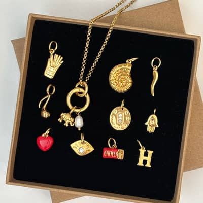 gold charm jewellery for women