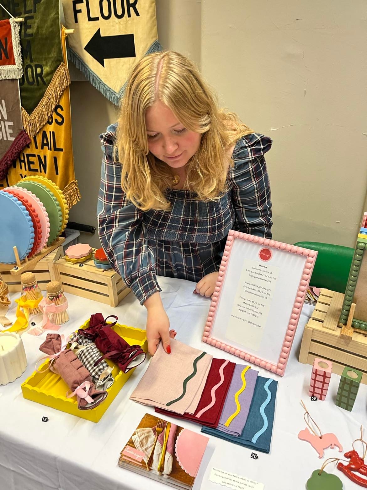 Founder of sugar & cement, Gemma standing behind her first market stall where the brand really started