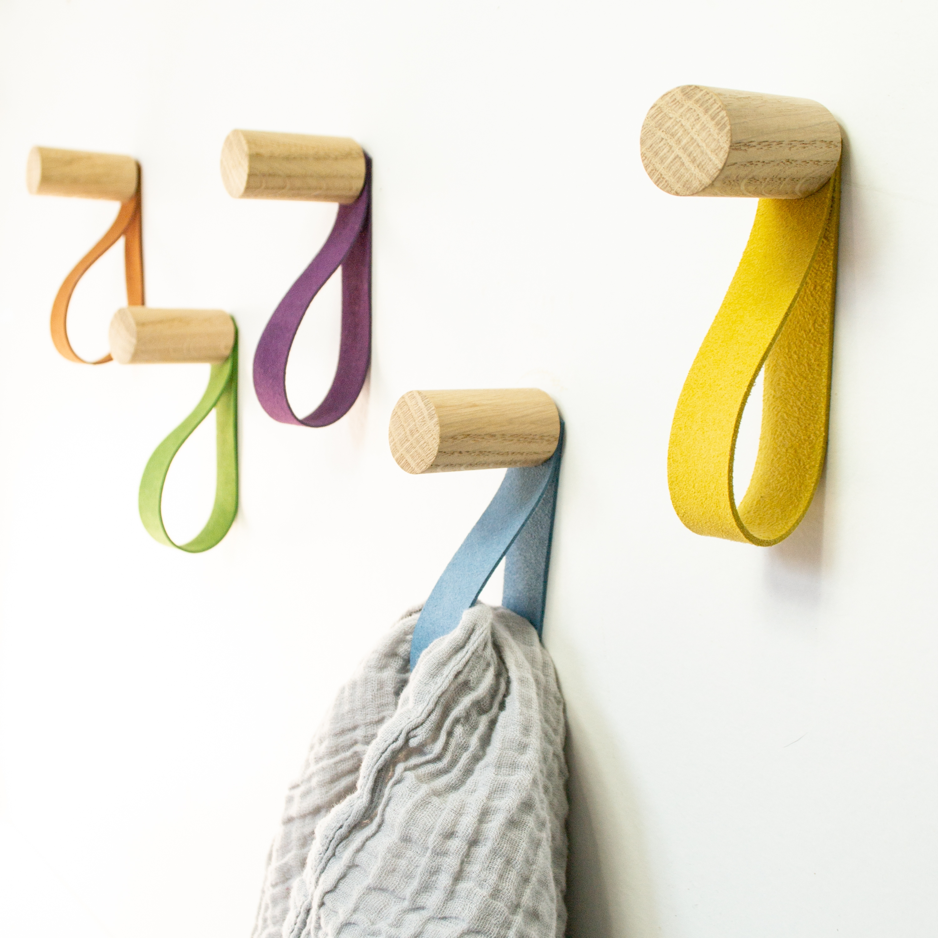 Wooden wall hook with leather strap