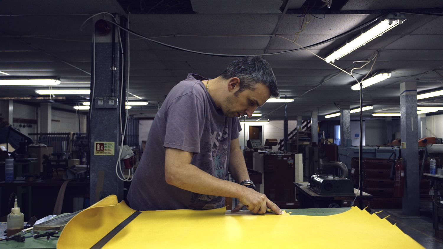 leather-worker Hand cutting leather