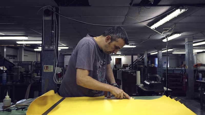 leather-worker Hand cutting leather