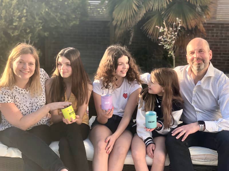 Family holding cans of mindfulness for children