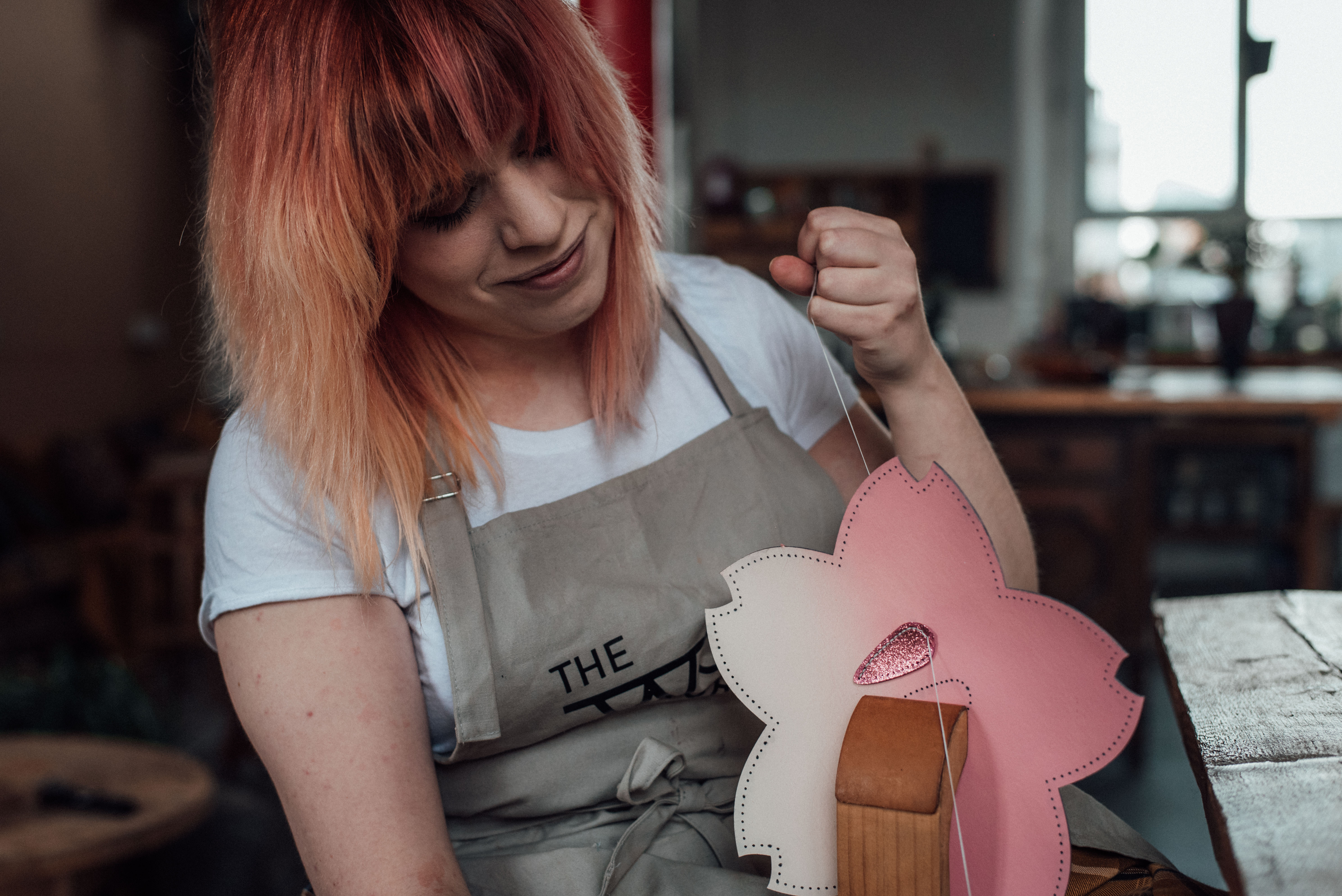 Pipa working on a cherry blossom pochette