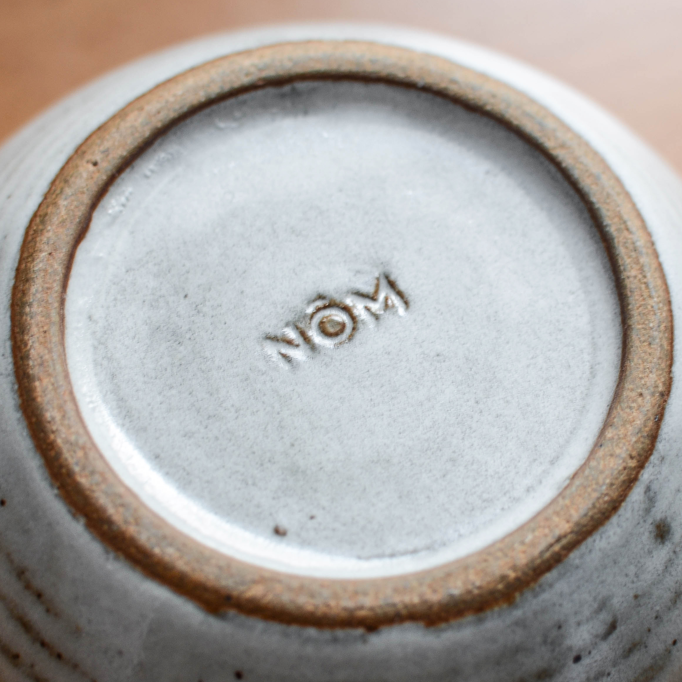Nom Living Clay Stamp Logo