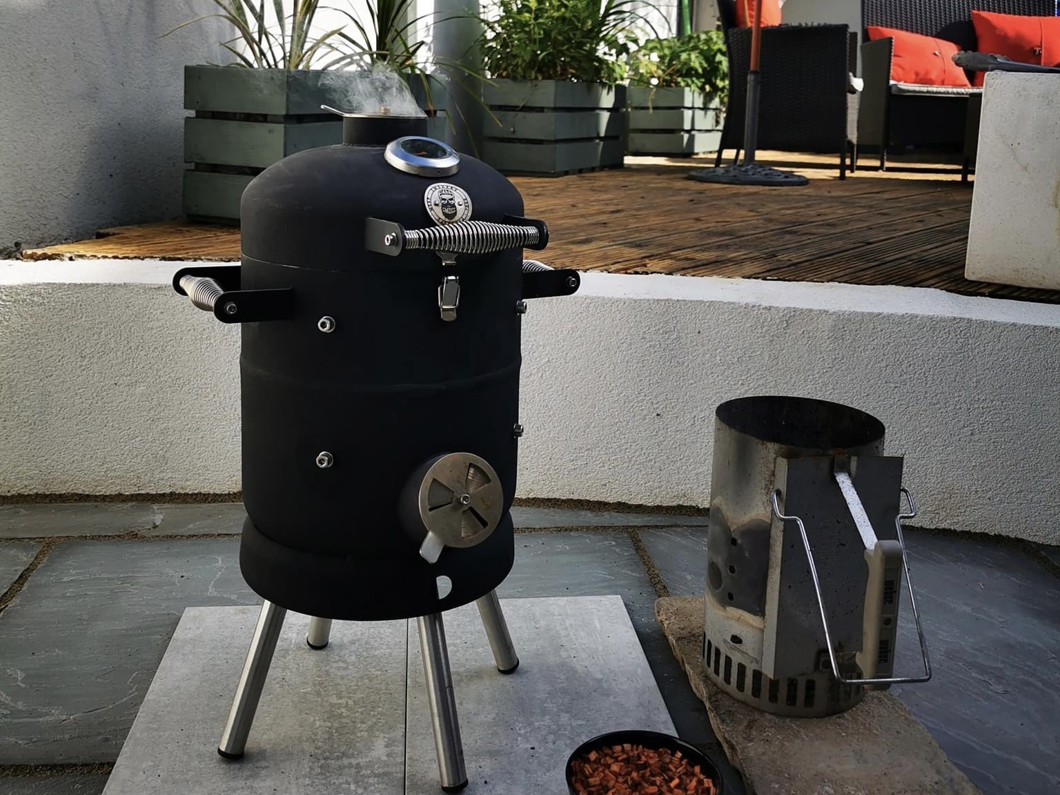 A BeardSmoke Mini-Un BBQ smoker being enjoyed in the garden