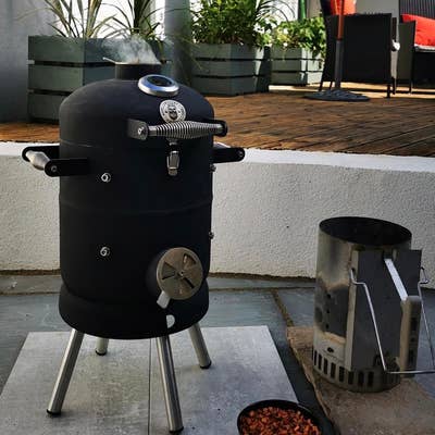 A BeardSmoke Mini-Un BBQ smoker being enjoyed in the garden