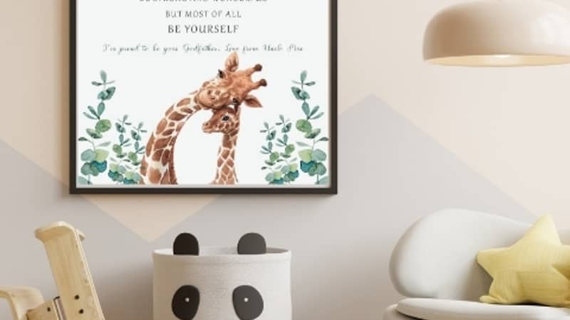 Personalised giraffe print for a godchild hanging on a nursery wall