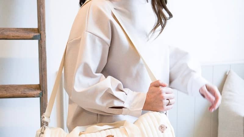 Model with maternity bag