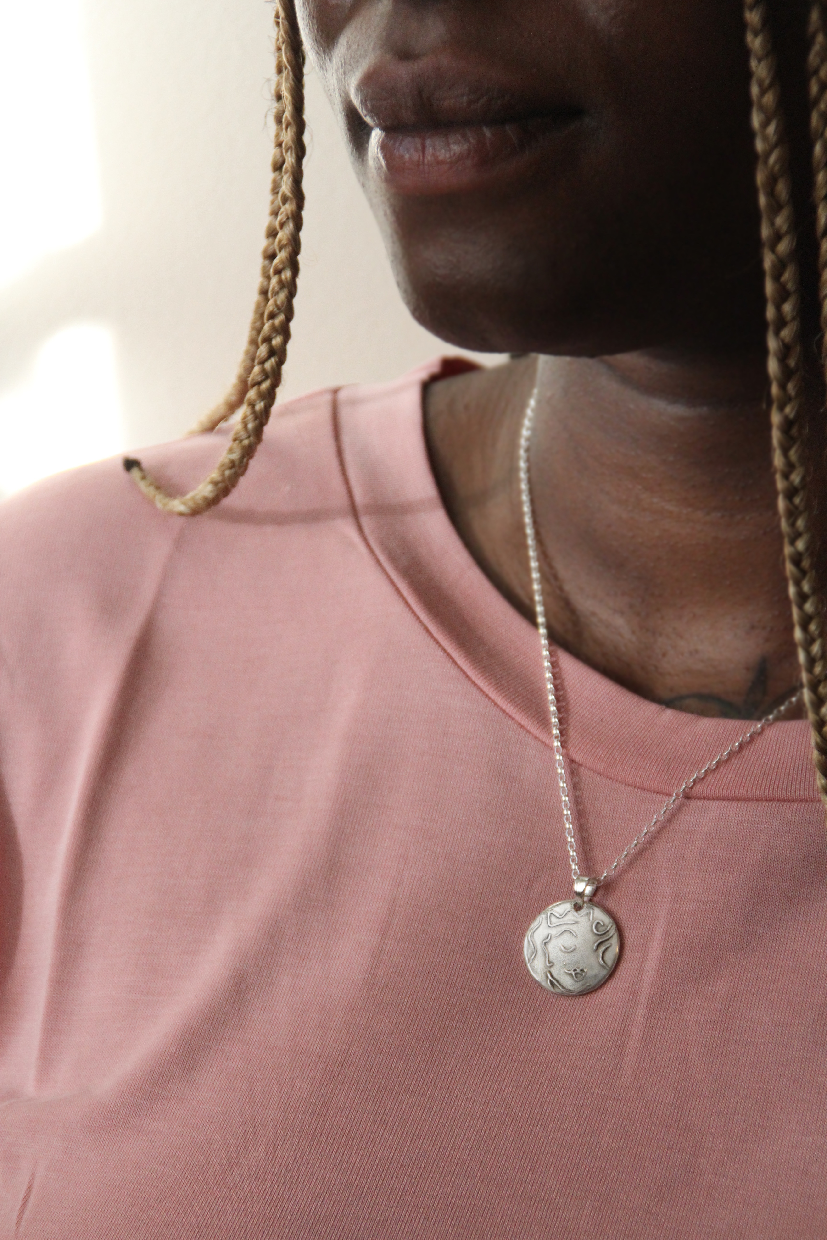 The empress queen silver pendant on model