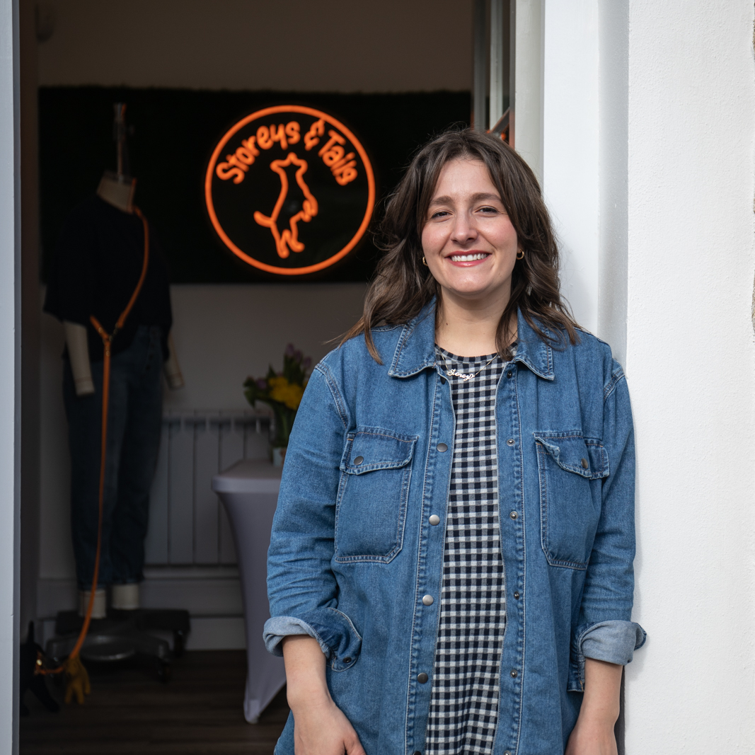 Natasha holding one of her dog collars in her studio