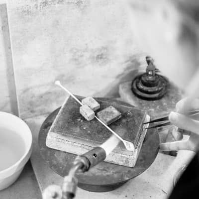 Jewellery designer, Emma-Kate, hand making and soldering silver Calla Lily jewellery