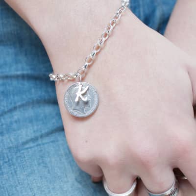 Lucky sixpence and initial bracelet