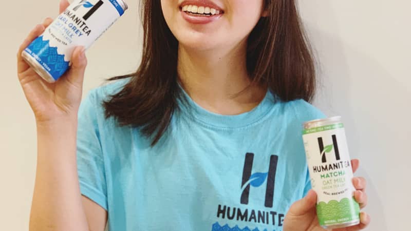 Tina Chief Tea Officer holding HumaniTea