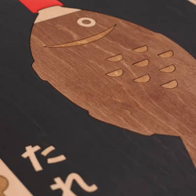 Close up of wooden wall art by snork of inspirational typographic poster reading freedom, knowledge, power