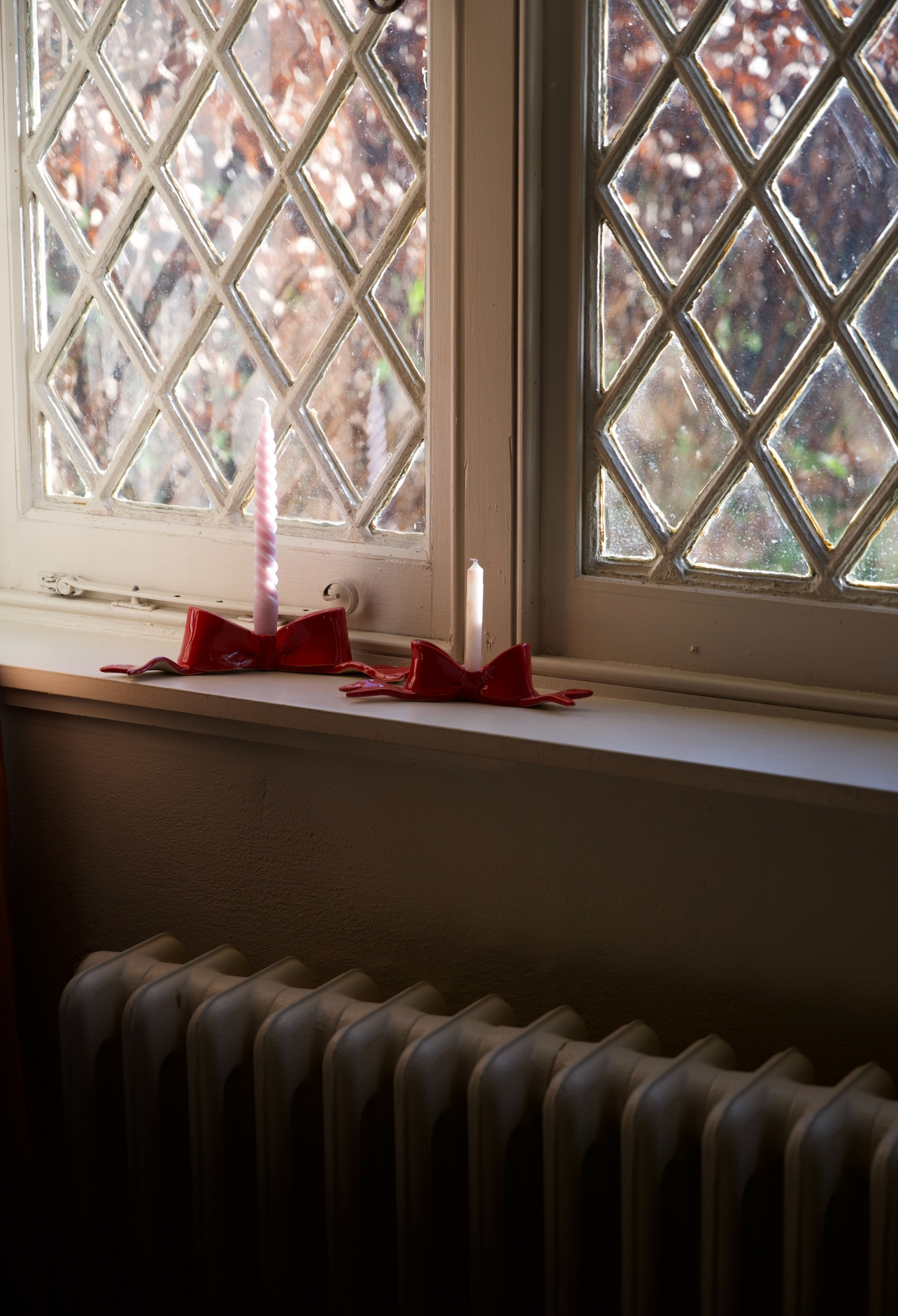 bow candlesticks on display in window
