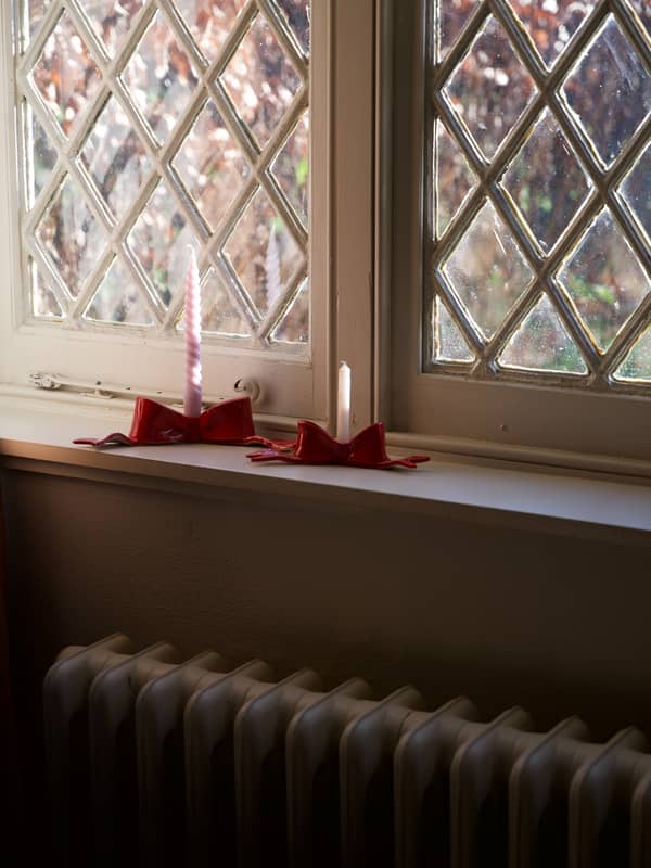 bow candlesticks on display in window