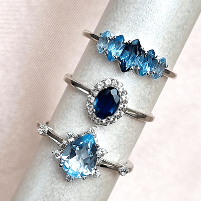 Blue sapphire halo ring, ombre blue topaz ring and sky blue topaz ring in sterling silver - Vianne Jewellery