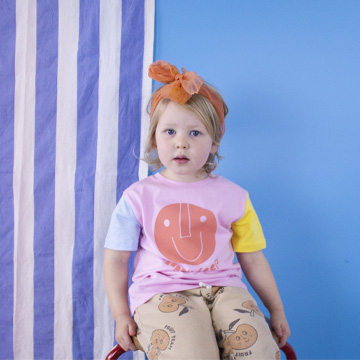 bed full of cushions and baby