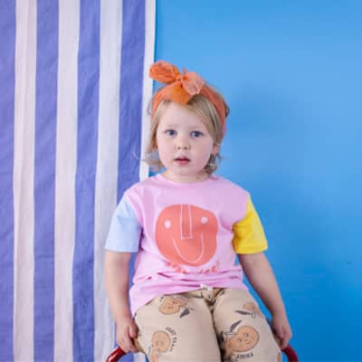 bed full of cushions and baby