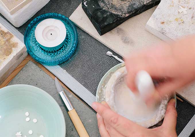 Mixing borax flux before silver soldering in the studio