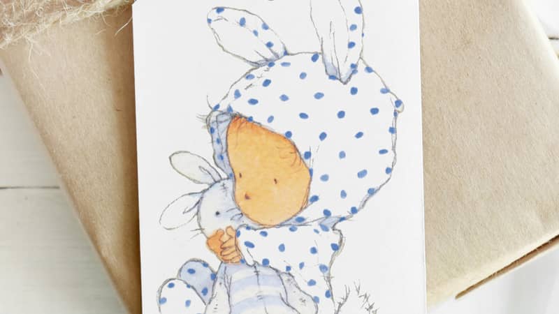 Little baby watercolour illustration on a gift tag to match wrapping paper