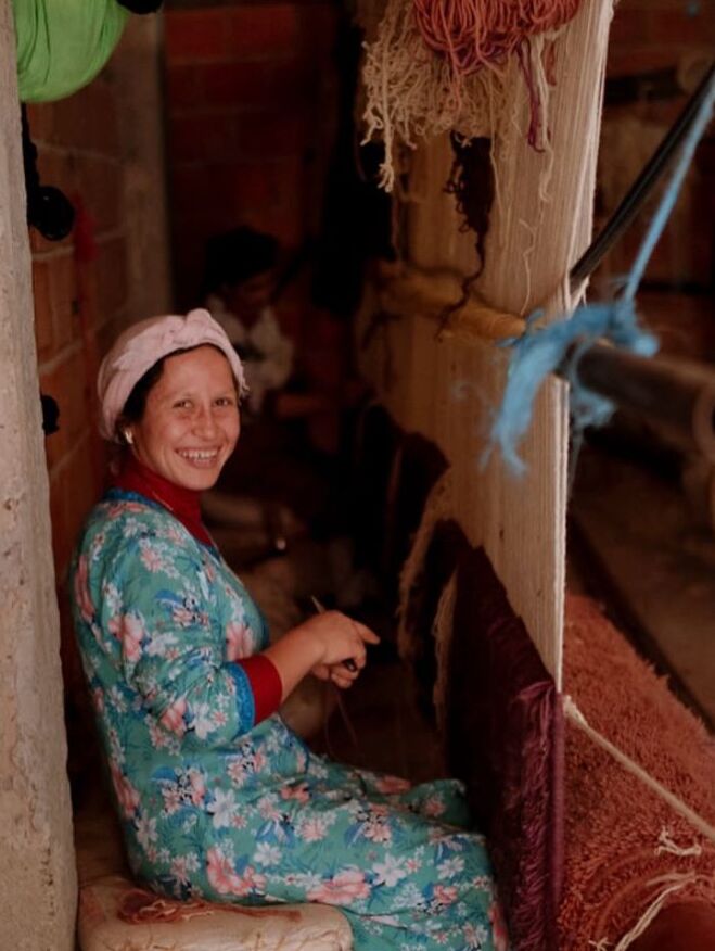 Female artisan using traditional hand loom