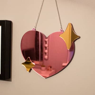 Pink and gold heart shaped wall mirror