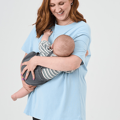 Mother breastfeeding their baby