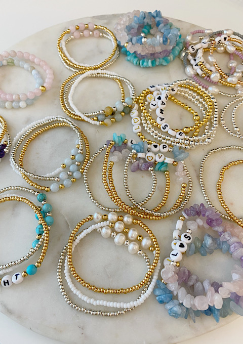 A selection of The Lovely Edit handmade and personalised semi precious bracelets