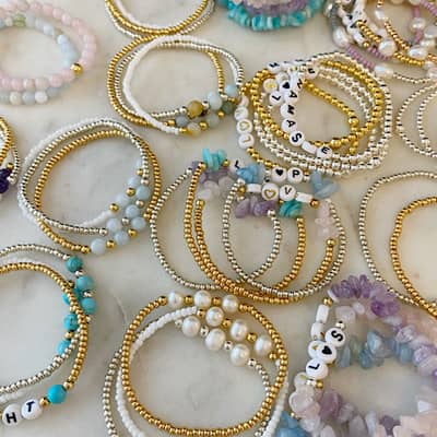 A selection of The Lovely Edit handmade and personalised semi precious bracelets