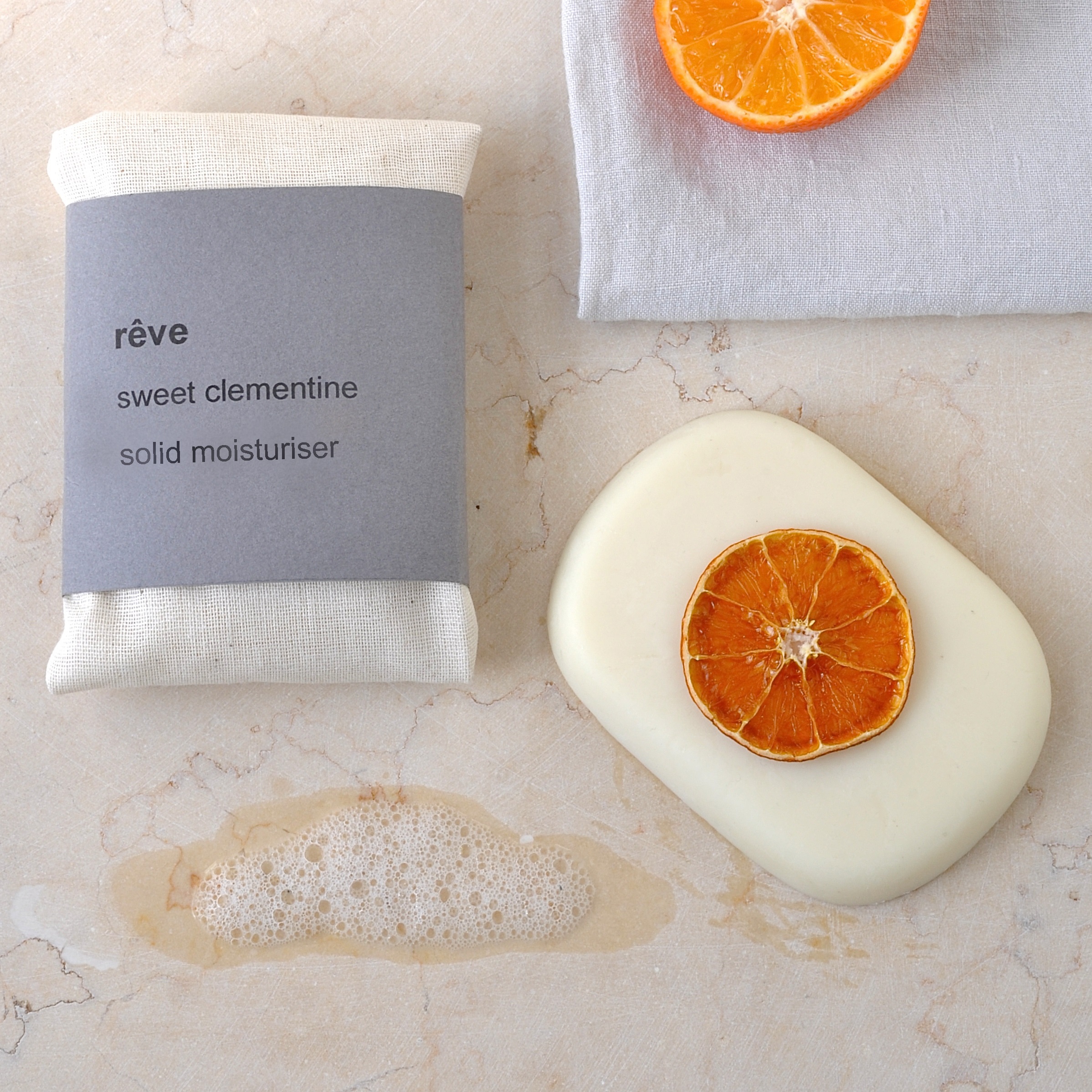 R?ve Sweet Clementine solid moisturiser