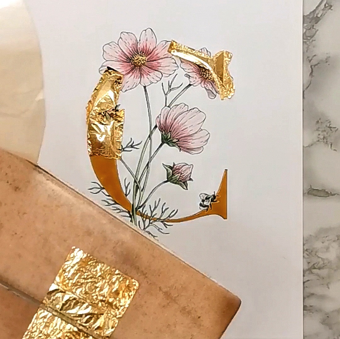 Gilding the letter C with loose gold leaf
