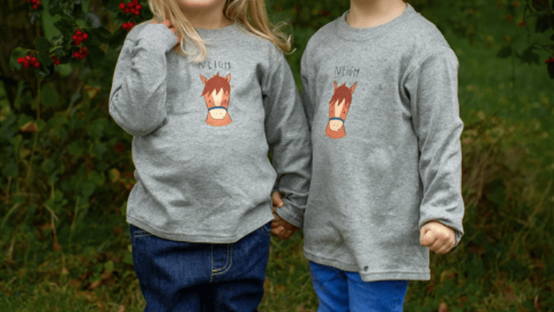 Little girls wearing Cheeky Horse T-shirt by Cotswold Baby Co