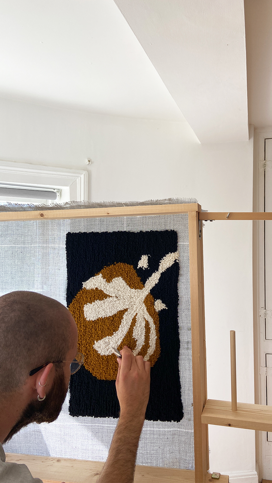 Each of our carpet cushions is tufted by hand using wool yarn before being sewn up by us in Brighton.