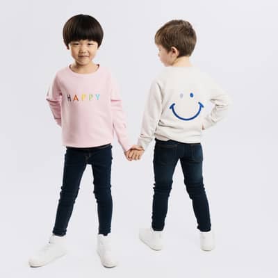 The Happy Sweatshirt features a big cute smile on the reverse and the word happy on the front in our signature rainbow text