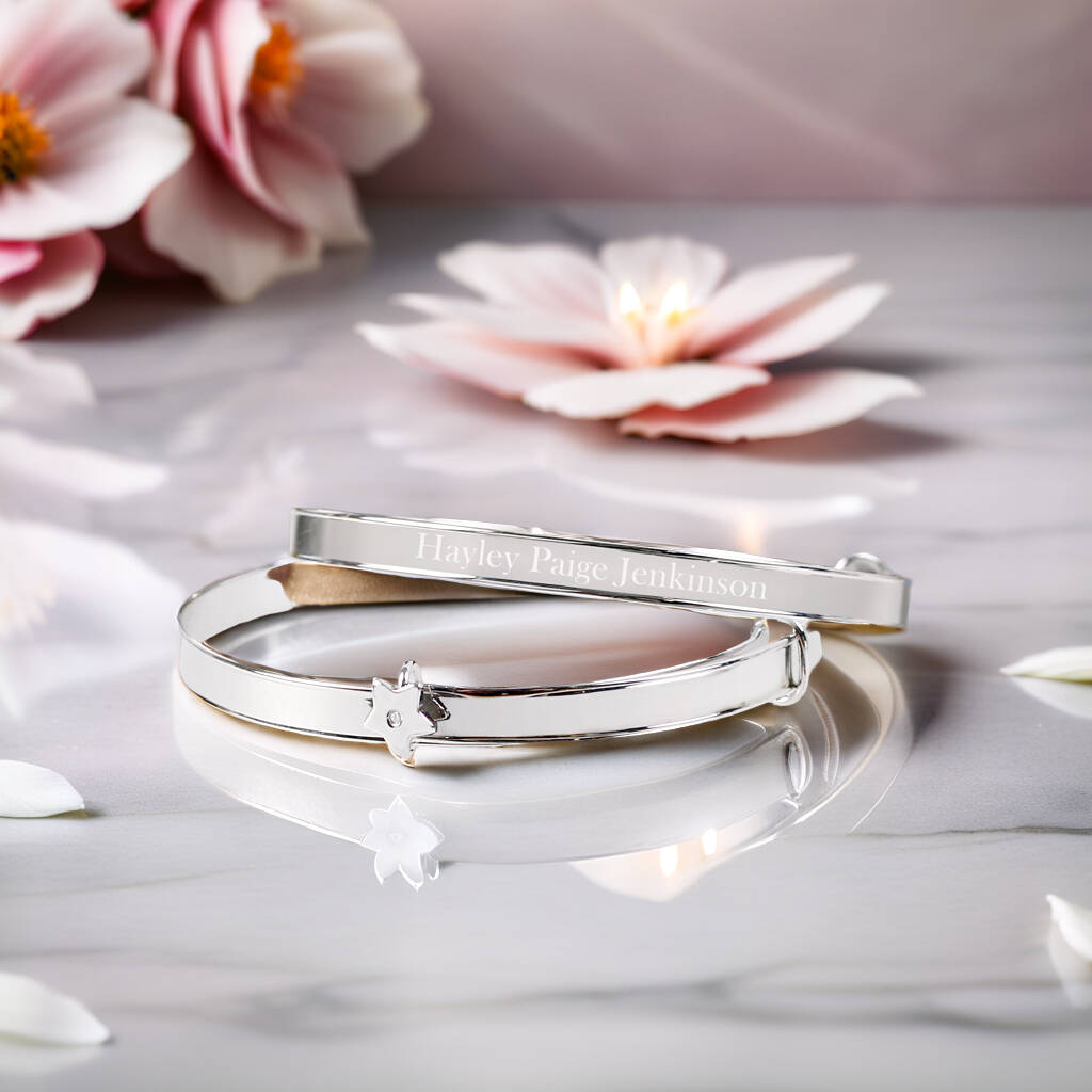Sterling silver expandable bracelet engraved with a name, featuring a diamante star charm.