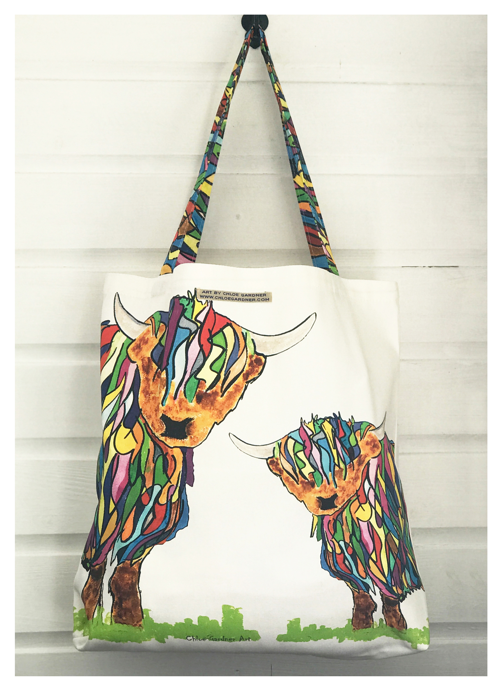 Chloe infront of some feather pictures and her famous crackers